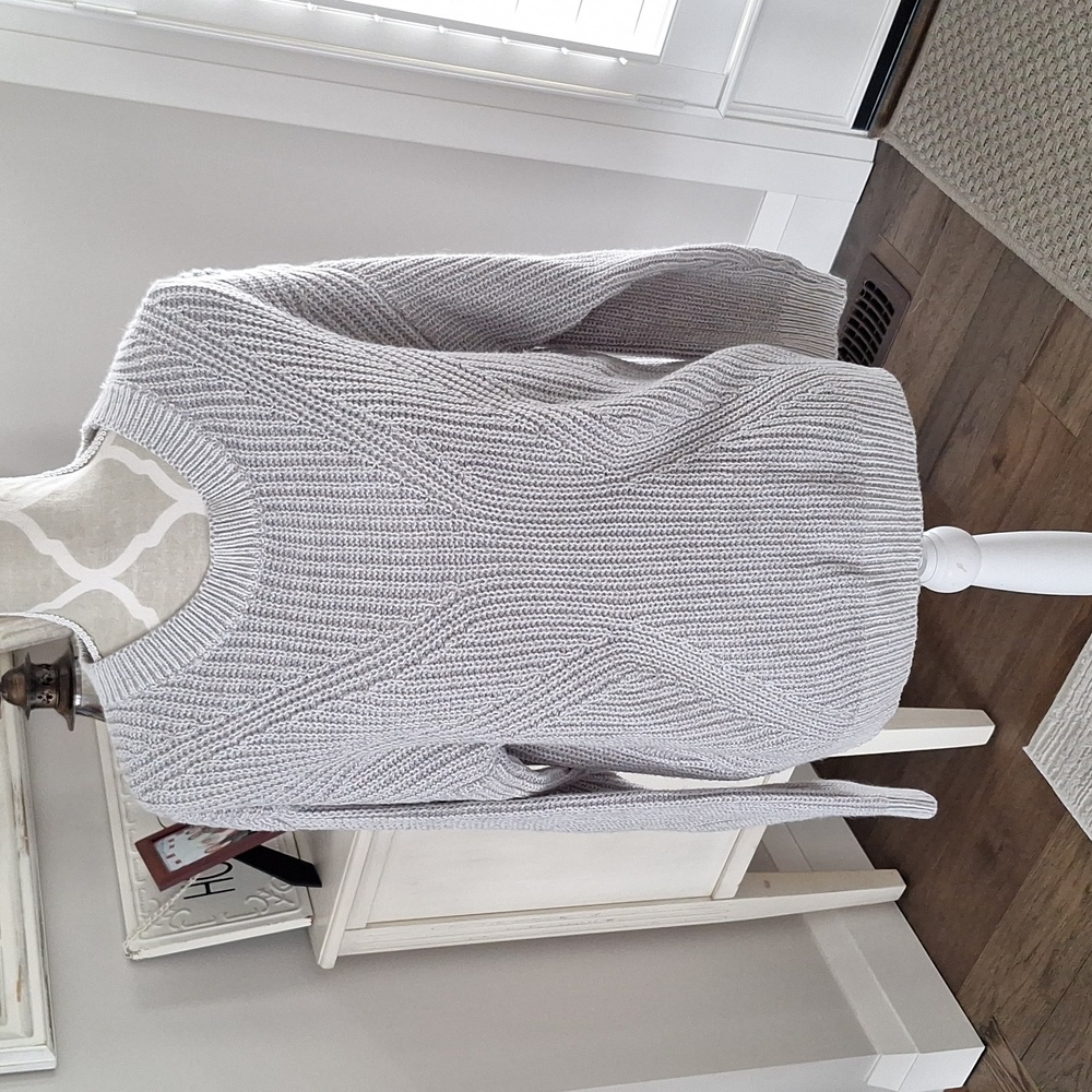 Medium sweater/ cut outs in back